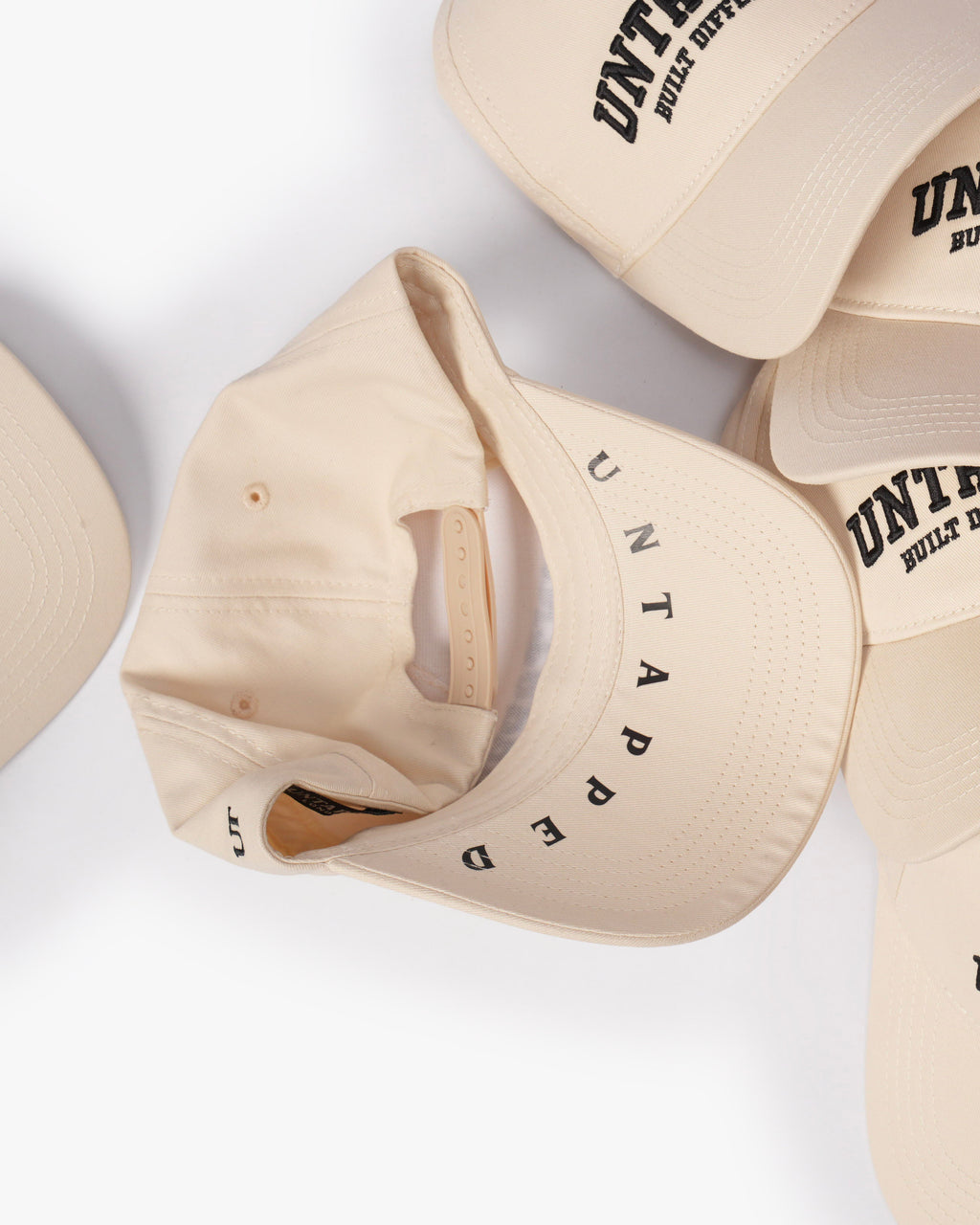 Untapped London Built Different Cap in Stone Beige, structured cotton twill cap